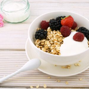 Delicious granola bowl topped with fresh berries and yogurt, perfect for a healthy breakfast.