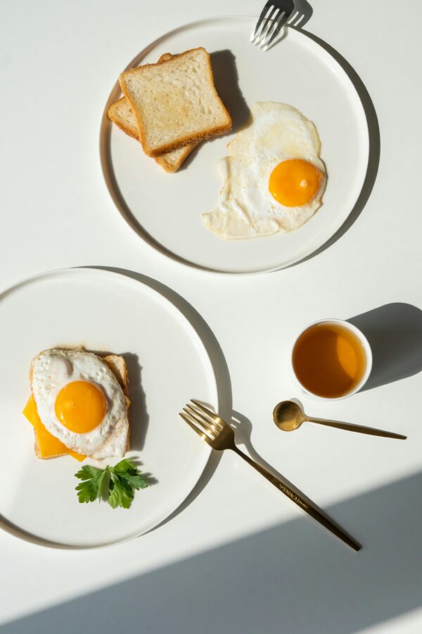 Minimalist breakfast featuring fried eggs, toast, and balanced composition for a fresh start.