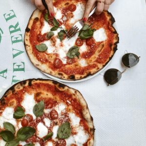 Enjoy a classic Margherita pizza in a Roman restaurant, perfect for a relaxed Italian meal.