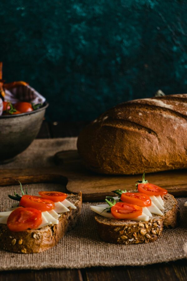 Delicious rustic bread topped with cheese and tomatoes served in a cozy indoor setting in Istanbul.