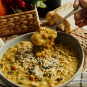 Close-up of lentil soup in a ceramic bowl with fresh vegetables, Erfurt.